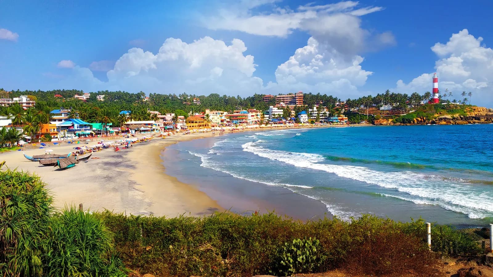 The sweeping bay of Lighthouse Beach and the Vizhinjam lighthouse at Kovalam